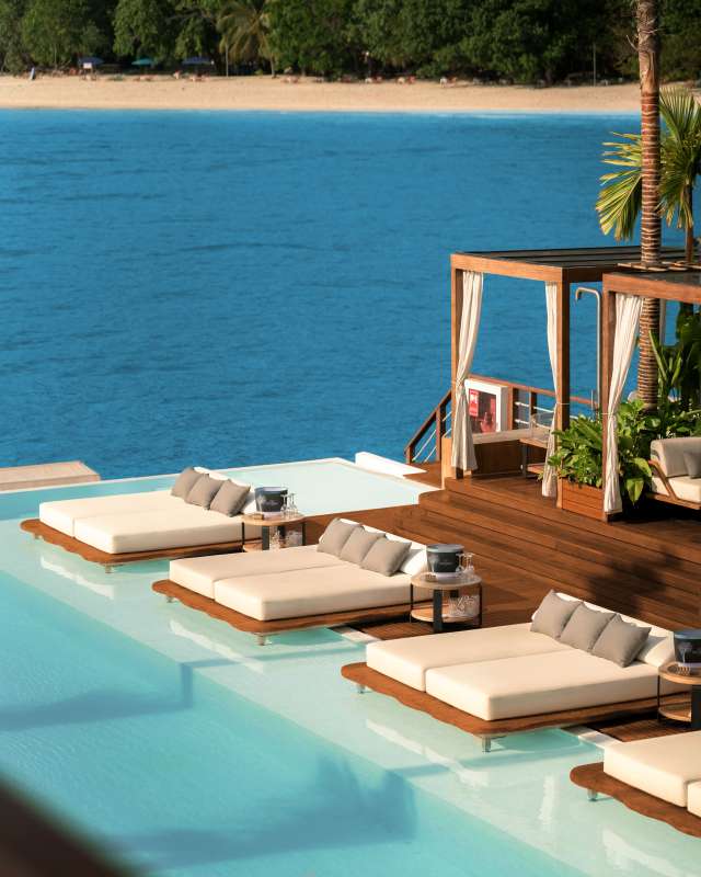 Welcome to YONA & settle into private bed or cabana